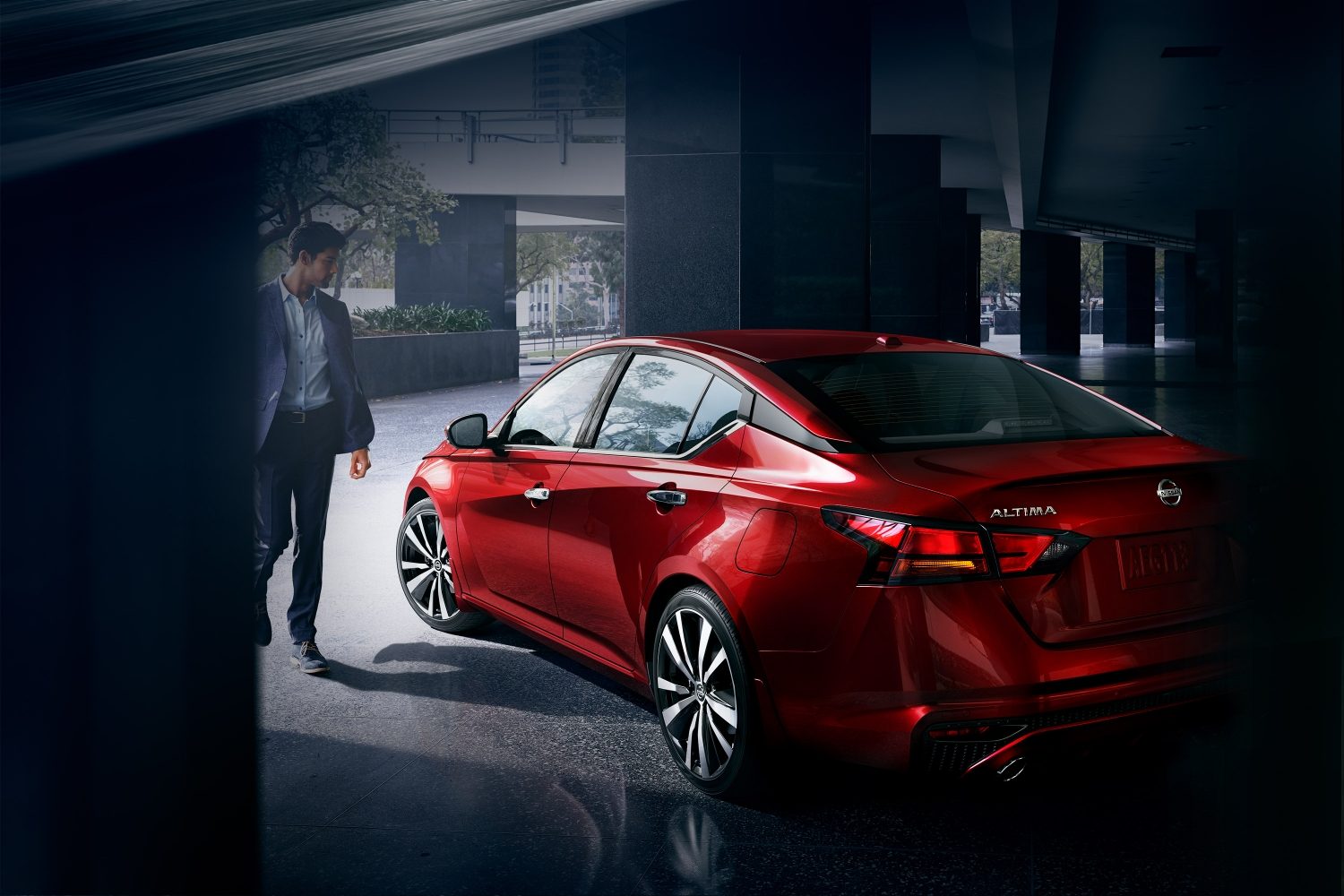Red NISSAN ALTIMA in the garage